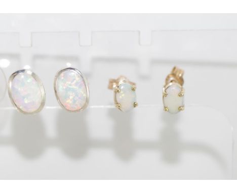 A pair of delicate 9ct gold & opal studs weighing approx 0.9 grams, together with a silver set of solid opal earrings