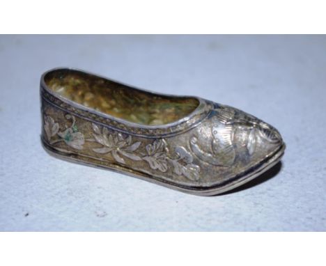 Chinese silver miniature shoe embossed decoration, character marks to base and stamped '90.' Length 6cm approx. Weight 24gram
