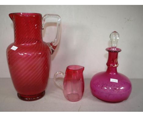 Three various ruby red glass items to include scent bottle, jug and creamer, 24cm height approx (jug), as inspected