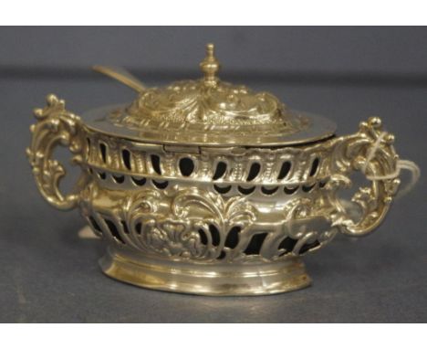 Edwardian sterling silver mustard pot Chester 1902, pierced decoration, with blue glass liner; together with sterling silver 
