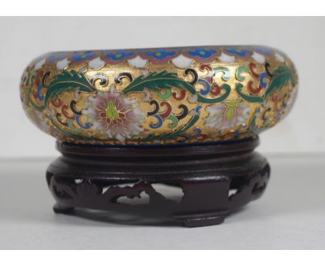 Chinese cloisonne bowl & stand enamel and gilt decoration, on carved wood stand. Diameter 13cm approx.