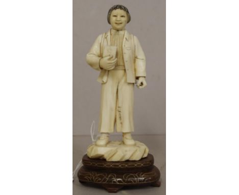 Antique oriental carved ivory figure Standing figure with book in hand. On fitted wood stand. Export of this item would be su