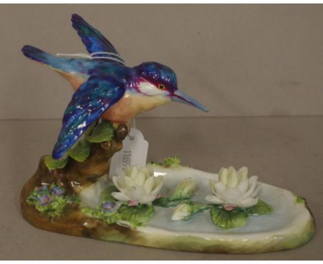 Vintage Crown Staffordshire bird figure marked and signed to base by J.T. Jones, applied floral decoration. Height 11cm appro