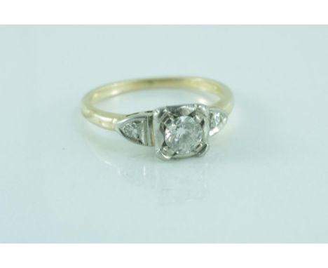 White gold and diamond ring set in 14ct gold with a centre round diamond and a diamond on each shoulder, weighing approx 2.2 