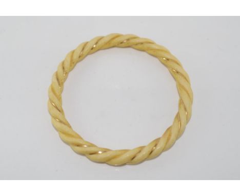 Vintage ivory twist bangle with gold thread circa 1950s, internal diameter approx 6+cm. NB This item may not be exported with