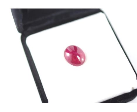 An unset oval ruby cabochon approx 4.3ct