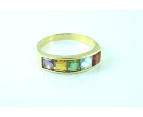 Yellow gold, multi gem set ring set in 18ct gold with garnet, amethyst, citrine and blue topaz, weighing approx 2.8 grams, si