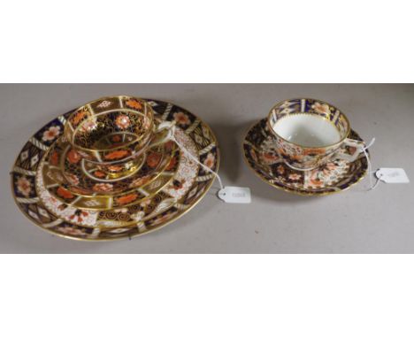 Six pieces vintage Royal Crown Derby tableware including trio; a cup & saucer; and a cake plate. Diameter 23cm approx (cake p