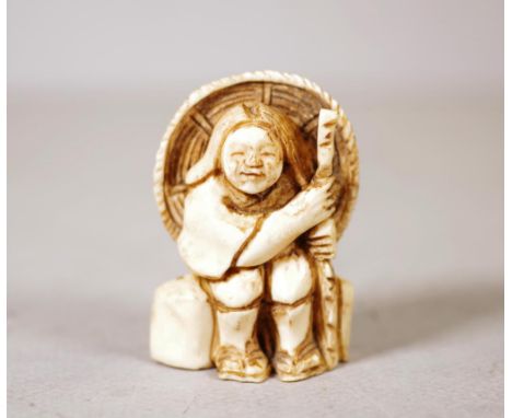 Antique Japanese carved ivory netsuke seated man with walking staff. Export of this item would be subject to CITES approval. 