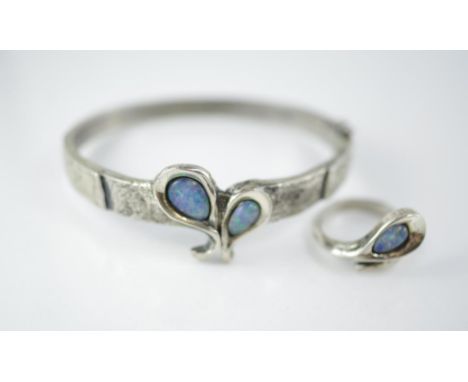 A handmade silver & opal hinged bracelet & ring both marked 835 pe, ring adjustable size