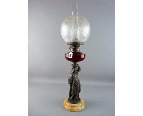 A CIRCA 1900 FIGURAL OIL LAMP having a circular stepped marble base with metal classically dressed woman column carrying a cr