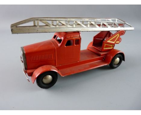 A TINPLATE CLOCKWORK FIRE ENGINE in red livery with added gold highlighting and single top ladder, stamped 'Made in US Zone, 
