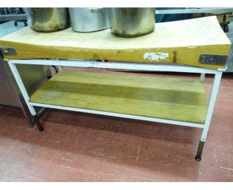 *A WOODEN BUTCHER'S BLOCK, 150 x 60 cms set on a metallic table with wooden base shelf