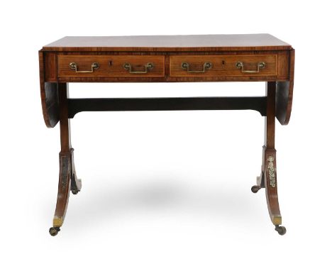 A Regency Rosewood, Crossbanded and Rosewood-Strung Sofa Table, early 19th century, with twin oval dropleaves above two mahog