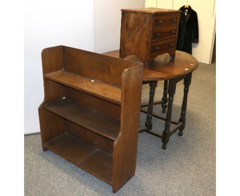 An Oak Three Tier Waterfall Bookcase, 80cm by 27cm by 89cm, together with an oak gateleg table and a small commode (3)