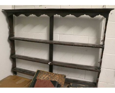 An Oak Plate Rack, 18th century, with quarter moulded cornice over a repeat bracket outline frieze, the upper shelves with po