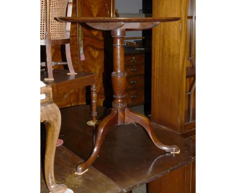 A George III Mahogany Dish Topped Tripod Table, 63cm by 71.5cm, together with a Queen Anne style walnut stool with drop in se