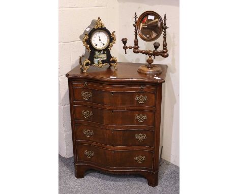 A Reproduction Mahogany Bachelor's Chest, with brushing slide, 61cm by 39cm by 75cm, together with a shaving mirror with turn