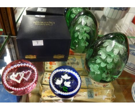 Five paperweights including a pair of dump weights, Caithness Spindreath limited edition boxed weight, Caithness twin hearts 