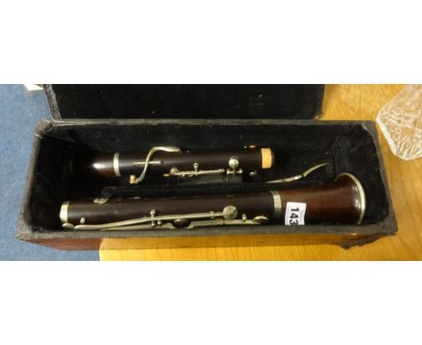A rosewood cased clarinet, boxed.
