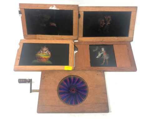 Four Victorian Magic Lantern slipping slides and a mechanical rackwork slide (5)   Condition Report Click here for further im