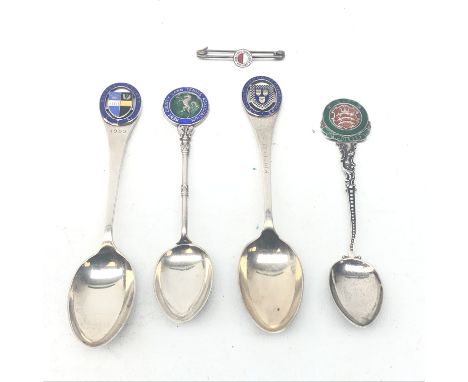 Four silver &amp; enamel Tennis tea spoons and a 1897 Berlin Tennis brooch (5) Condition Report Click here for further images