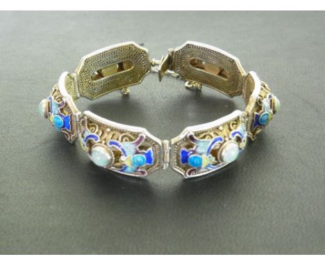 A silver gilt, enamel and green-gem panel bracelet - With foreign marks - Length approx 17cms - Weight approx 31.5gms
Conditi