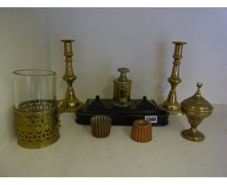 An unusual Edwards Patent desk stand, a pair of brass candlesticks, two small copper moulds, a brass chamber stick and an Isl