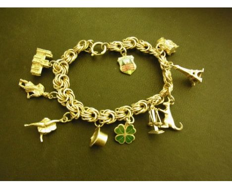 A fancy-link bracelet suspending ten assorted charms - With marks indicating silver - Length 19cms - Weight approx 41.3gms
Co