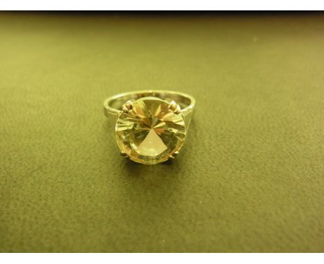 A white sapphire single-stone ring - Sapphire 11.5mm - Stamped 18ct - Ring size N - Weight approx 5.0gms
Condition Report: Go