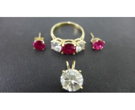 A synthetic ruby and white-gem three-stone ring - Stamped 14K - Ring size R 1/2 - Together with a pair of synthetic ruby ear 
