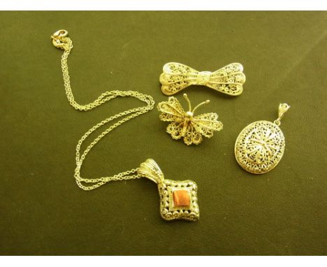 Four pieces of filigree jewellery - To include two pendants and two brooches - Two marks indicating silver - Total weight app