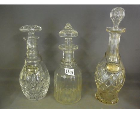 Three cut glass decanters and two silver labels
Condition report: Minor chips to one decanter