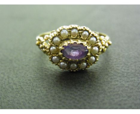 An amethyst and seed pearl cluster ring - Hallmarked London - Ring size P 1/2 - Weight approx 3.0gms
Condition Report: Good -