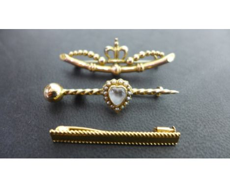 Three brooches - To include a moonstone and seed pearl cluster brooch - One with 9ct hallmark - One with marks indicating 18c