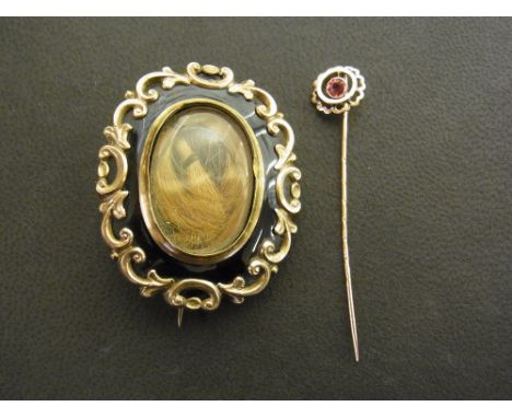 A Victorian gold plated hair inset mourning brooch and stick pin
Condition report: Large knock to back, damage to rim of inse