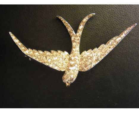 A superb 19th century silver, gold and diamond brooch - in the form of a swallow, the gold test to 18 ct - the entire upper s