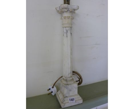 A marble column table lamp - Height 45 cm 
Condition report:  Tested - some chips