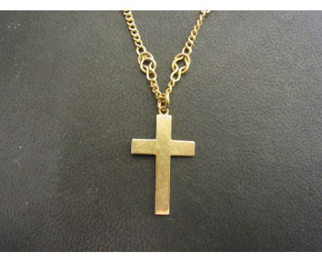 A cross pendant - Stamped 9ct - Length 3cms - Suspended from a fancy-link chain - Tests high carat gold - Length 52cms - Tota