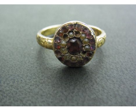 A late Victorian/early 20th century 18ct gold garnet, seed pearl and pink gem panel ring - Hallmarked London - Ring size R - 