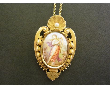 A continental gold seed pearl and painted panel pendant - Depicting a lady playing a harp with mother of pearl reverse - With