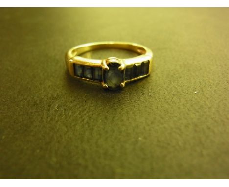 A 9ct gold sapphire dress ring - Hallmarked Sheffield - Ring size M - Weight approx 2.5gms
Condition Report: Good - With ligh