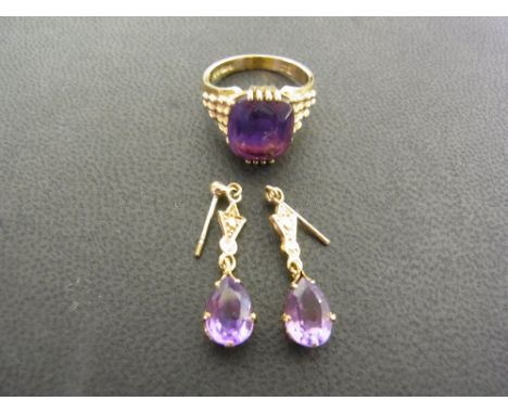 A pair of 9 ct gold amethyst drop earrings, the stone tear drop shape approx. 8 mm in length and a 9 ct gold amethyst set dre