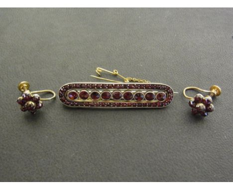 Bohemian garnet - a brooch and a pair of cluster earrings - Length of brooch 4.5cms.
Condition Report: Good to fair - With li