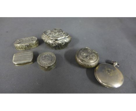 A Continental silver snuff box marked 800, a Continental silver pill box marked 900, a silver embossed box, a silver snuff bo