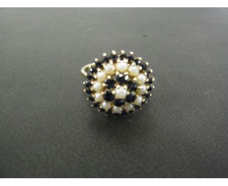 A seed pearl and sapphire three tier cluster ring - Tests as 9ct gold - Ring size P1/2 - Weight approx 3.5gms
Condition Repor