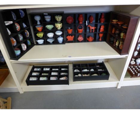 A collection of miniature porcelain Cinnabar and pottery vases, bowls and bowls of Oriental and Greek design on six stands