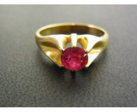 A synthetic ruby single-stone ring - Stamped 14K - Ring size T - Weight approx 5.7gms
Condition Report: Good - With light sur