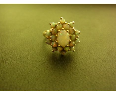 An 18ct gold two-tier opal cluster ring - Hallmark rubbed - Ring size O - Weight approx 4.6gms
Condition Report: Good - With 