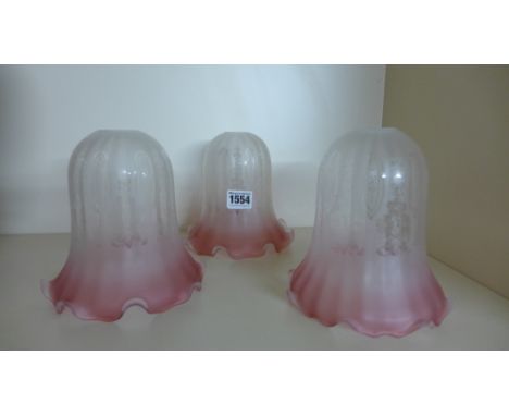 A set of three Cranberry tinted frosted and etched glass lamp shades - Height 15 cm
Condition report: No faults
